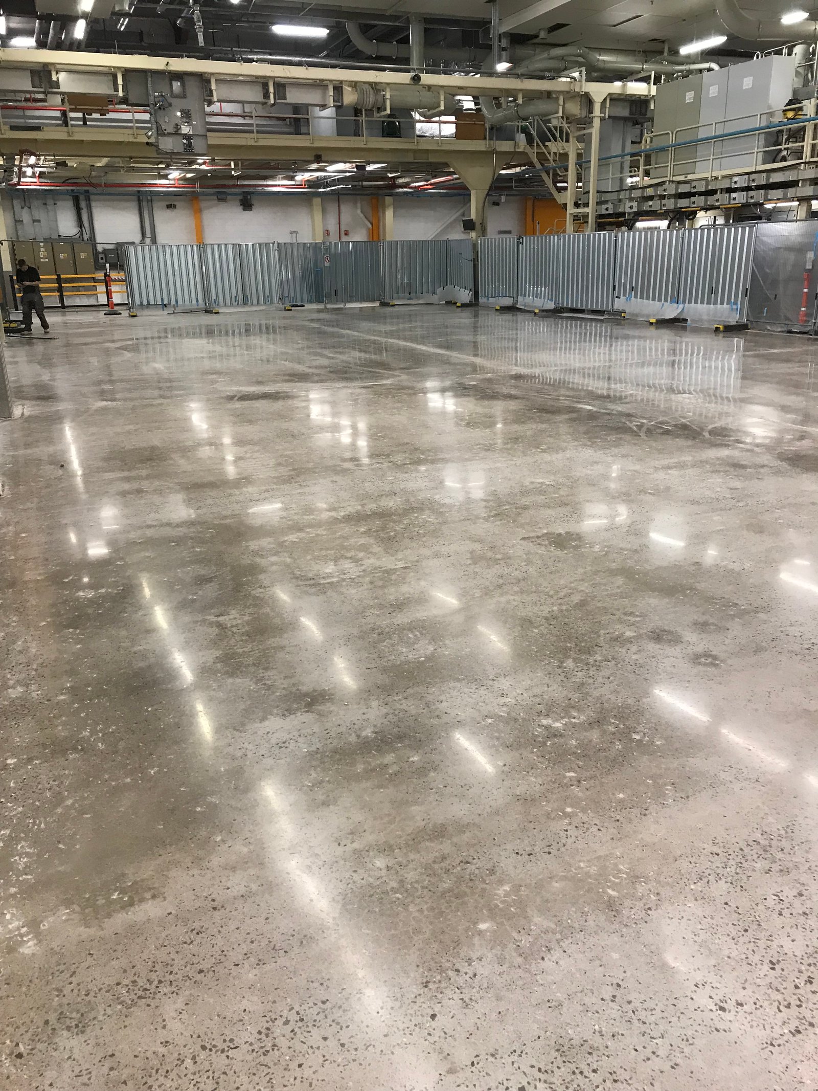 Industrial polished concrete — phased installation in live production facility
