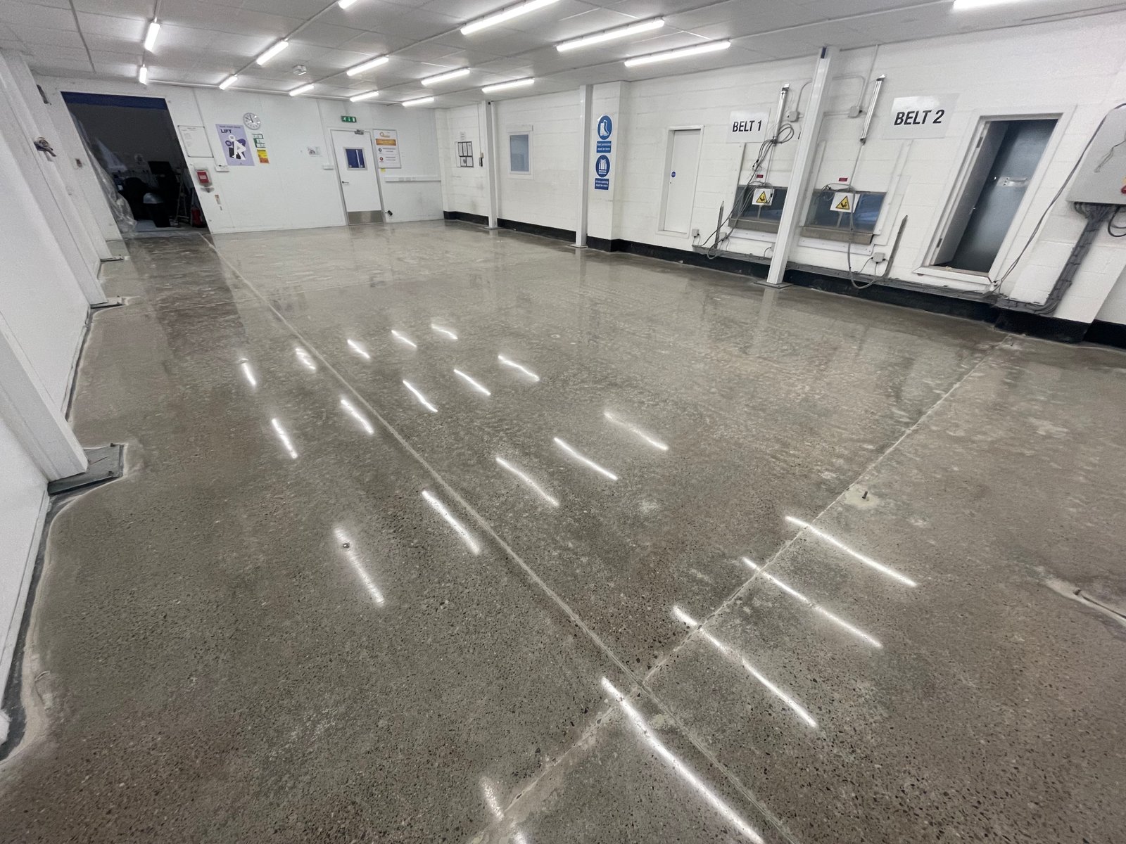 Industrial polished concrete densified slab — manufacturing plant