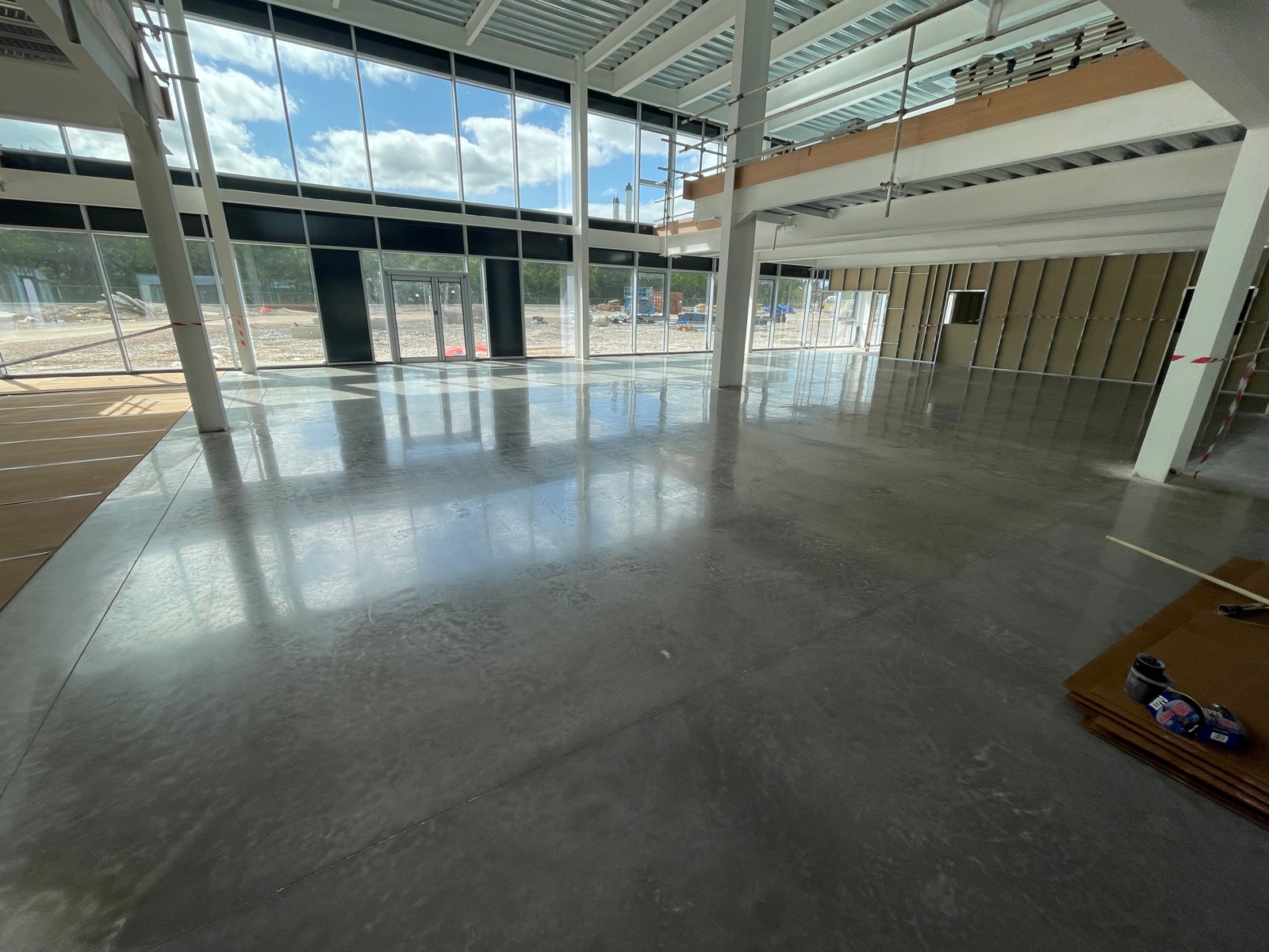 Commercial polished concrete retail showroom — mirror finish