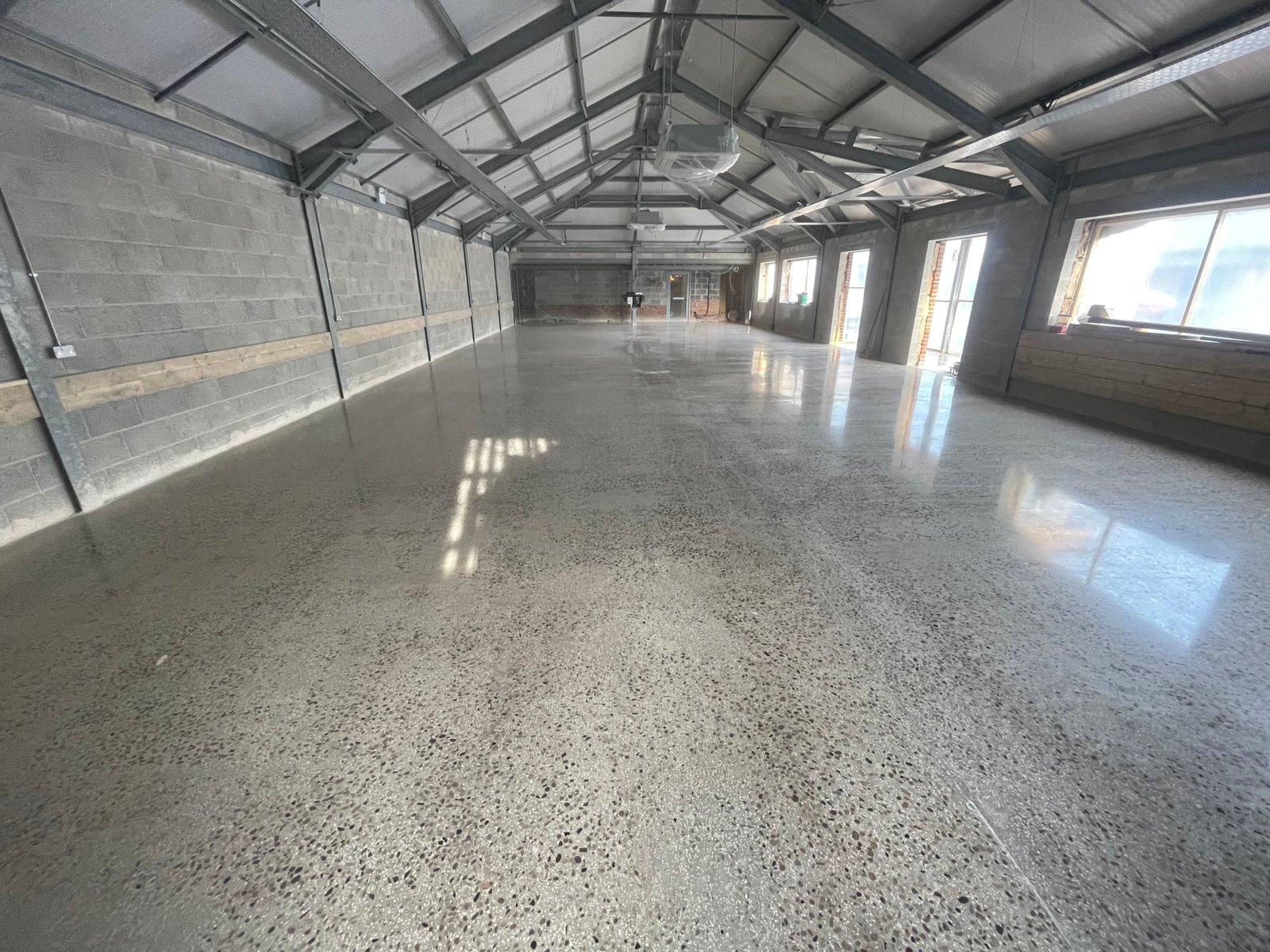 Commercial polished concrete full aggregate detail — barn conversion