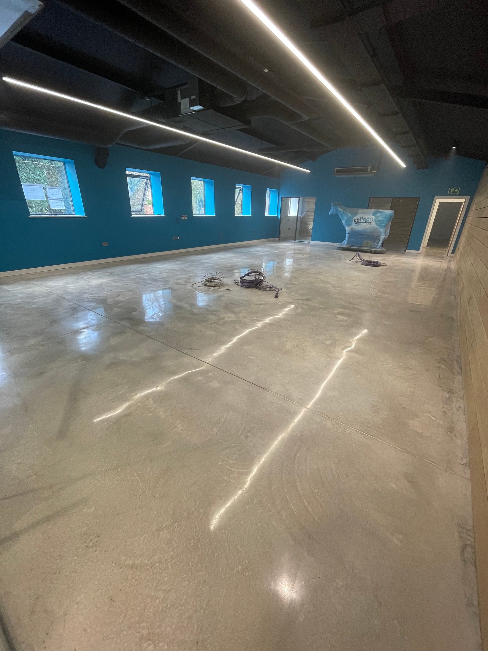 Commercial polished concrete restaurant floor with decorative art