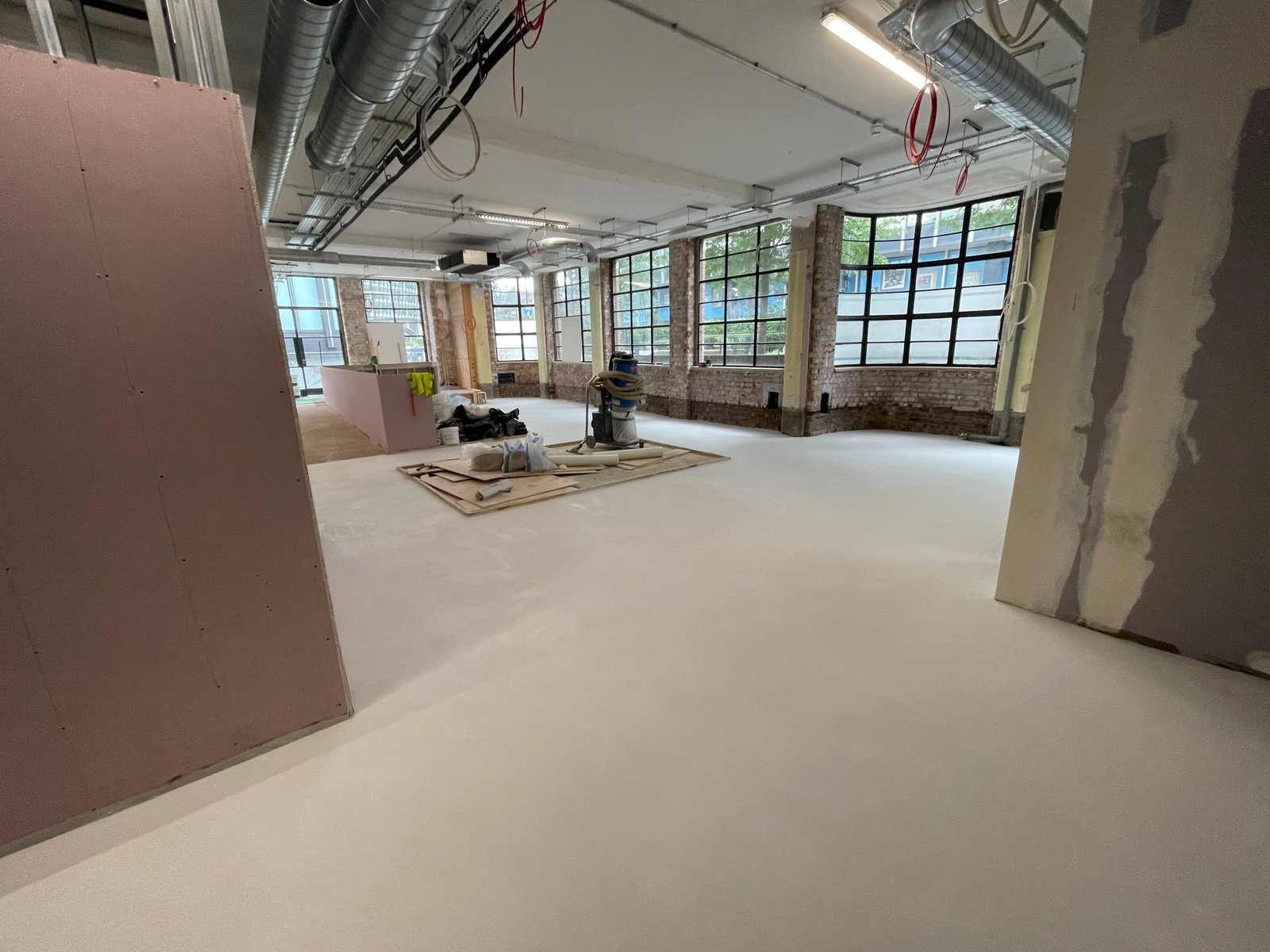 Polished concrete overlay in open-plan kitchen diner