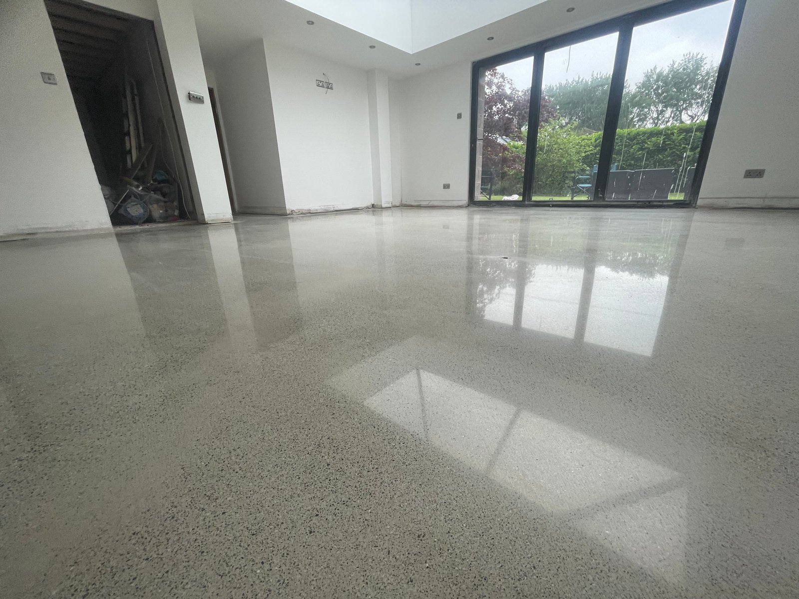 Concrete overlay in industrial space with brick columns