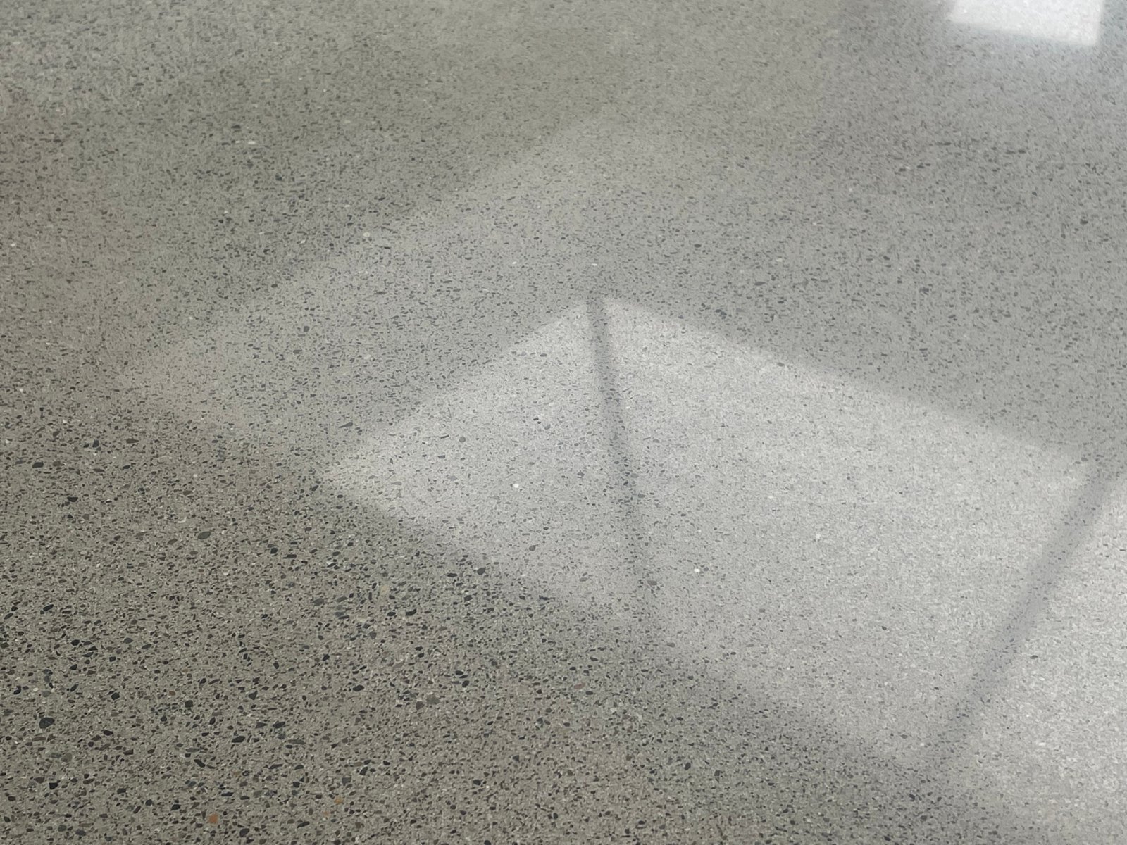 Concrete overlay at corridor and roller shutter threshold