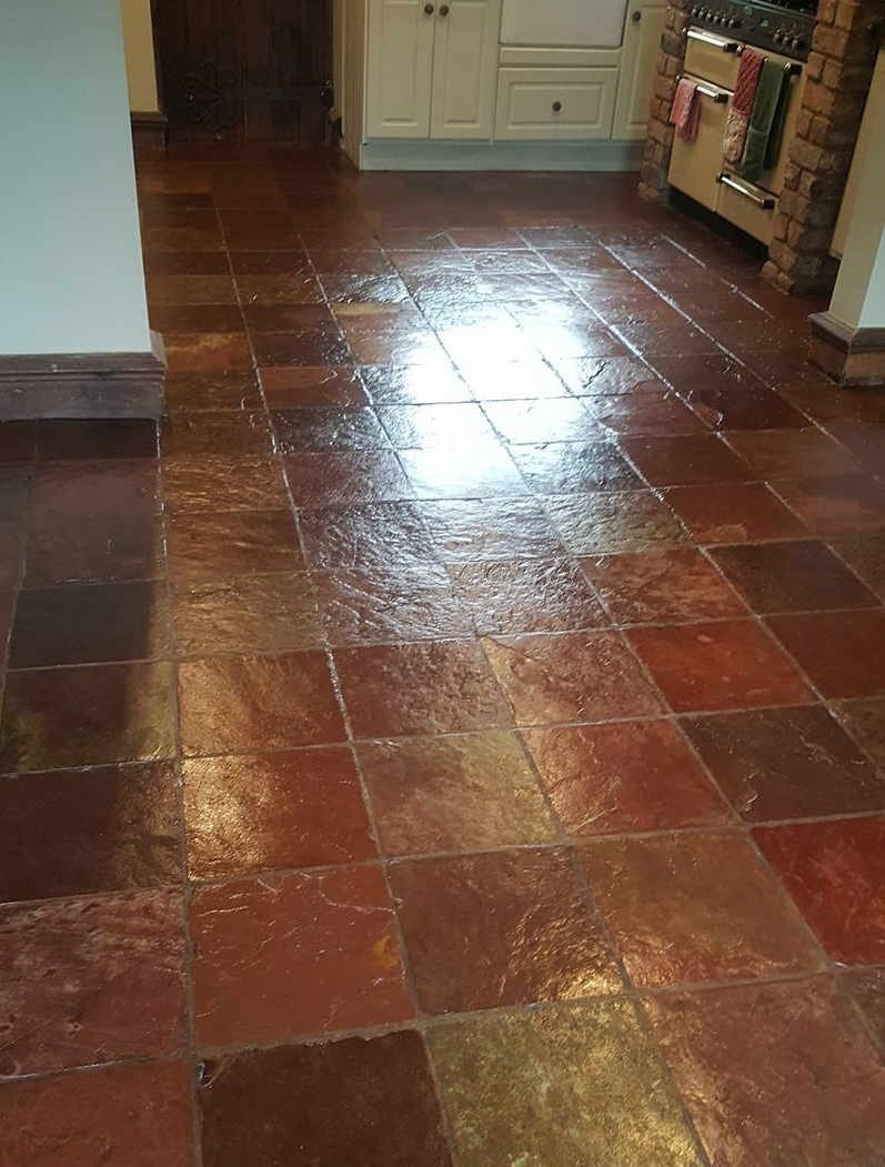 Indoor slate floor after restoration - enhanced colour and sealed finish