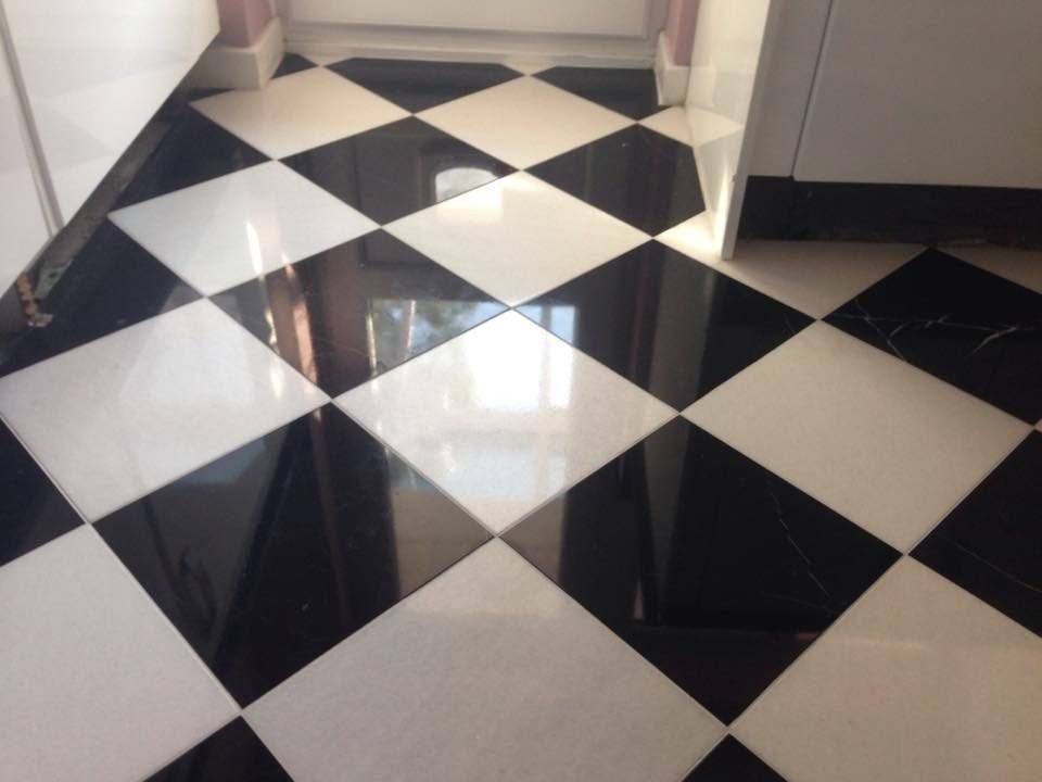 Marble floor restoration in progress - diamond grinding and polishing UK