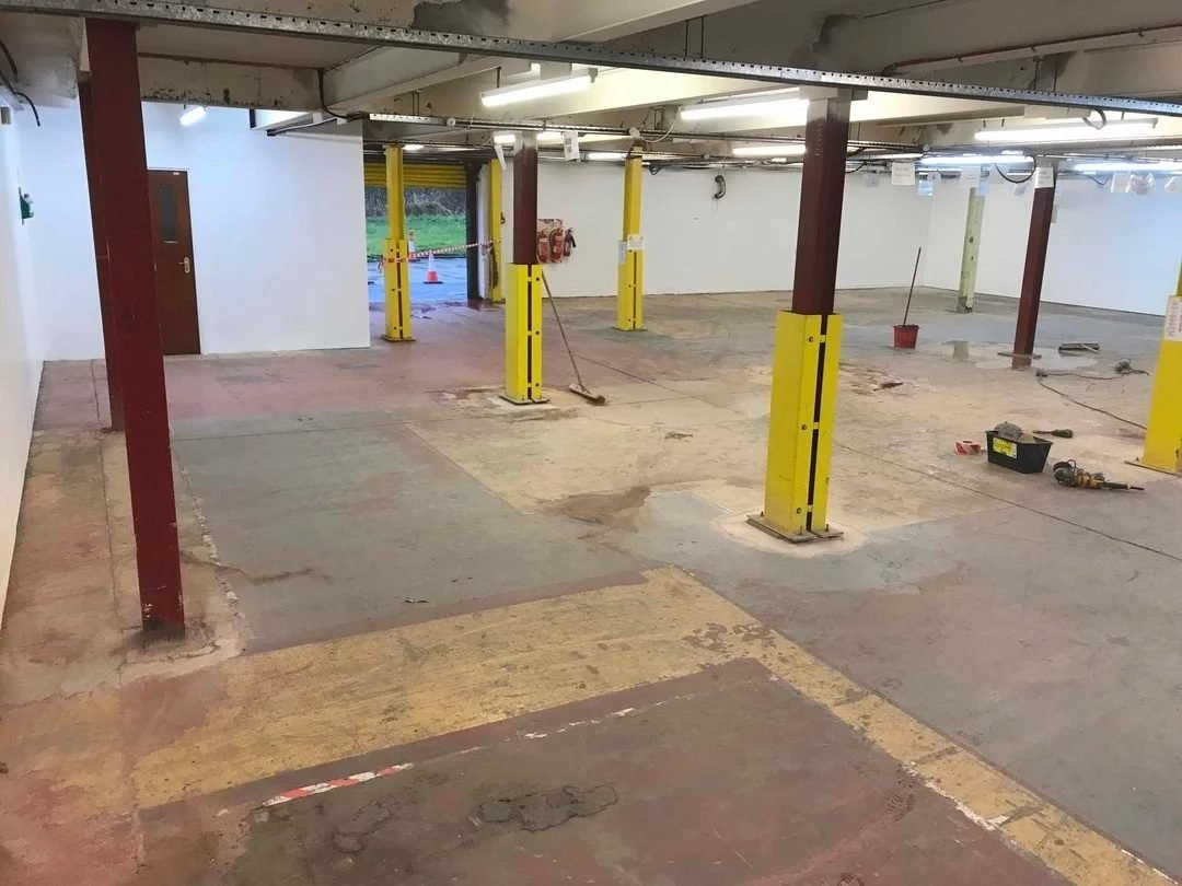 Industrial floor before concrete overlay - worn concrete surface