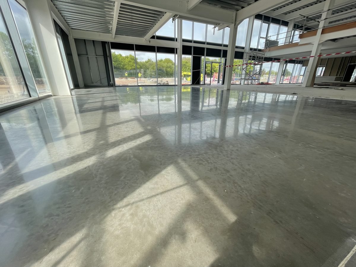 Commercial polished concrete retail showroom - natural grey finish
