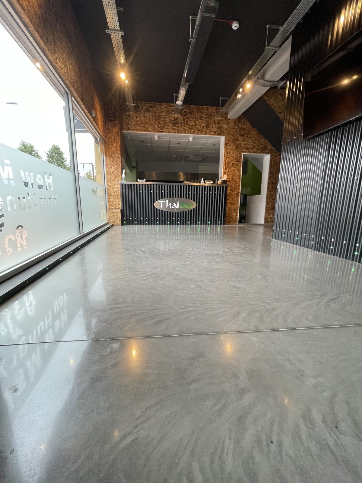Commercial polished concrete - satin finish restaurant corridor