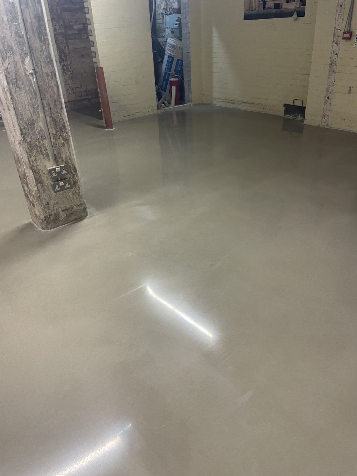 Polished concrete overlay - rear extension with rooflight UK