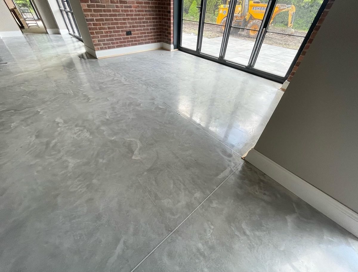 Cream aesthetic polished concrete floor - smooth minimal cement surface with almost no stone showing