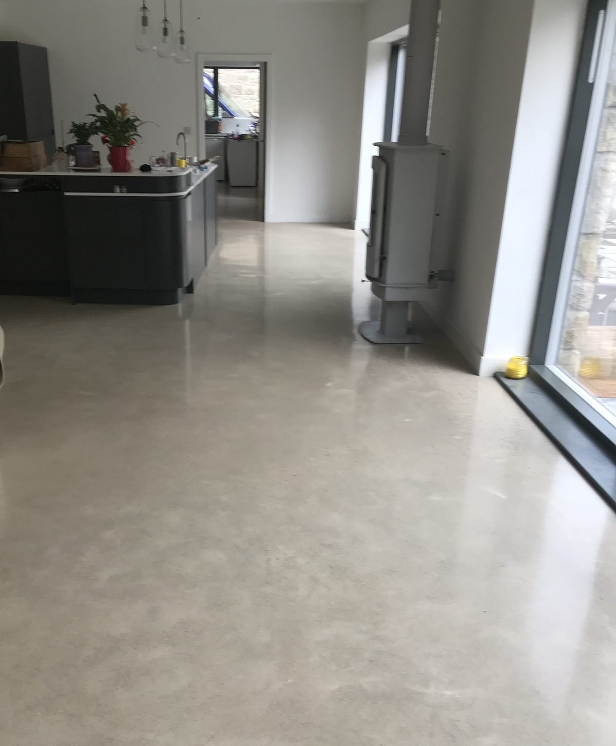Polished concrete floor with a salt and pepper finish showing fine sand and minimal stone